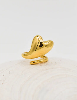 Gold pinky ring with abstract heart-shaped drop on shell