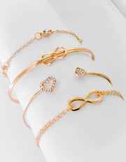 Montreal minimalist jewelry set with knot and infinity symbols