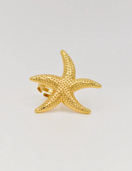 Gold starfish ring with textured finish on clean white background